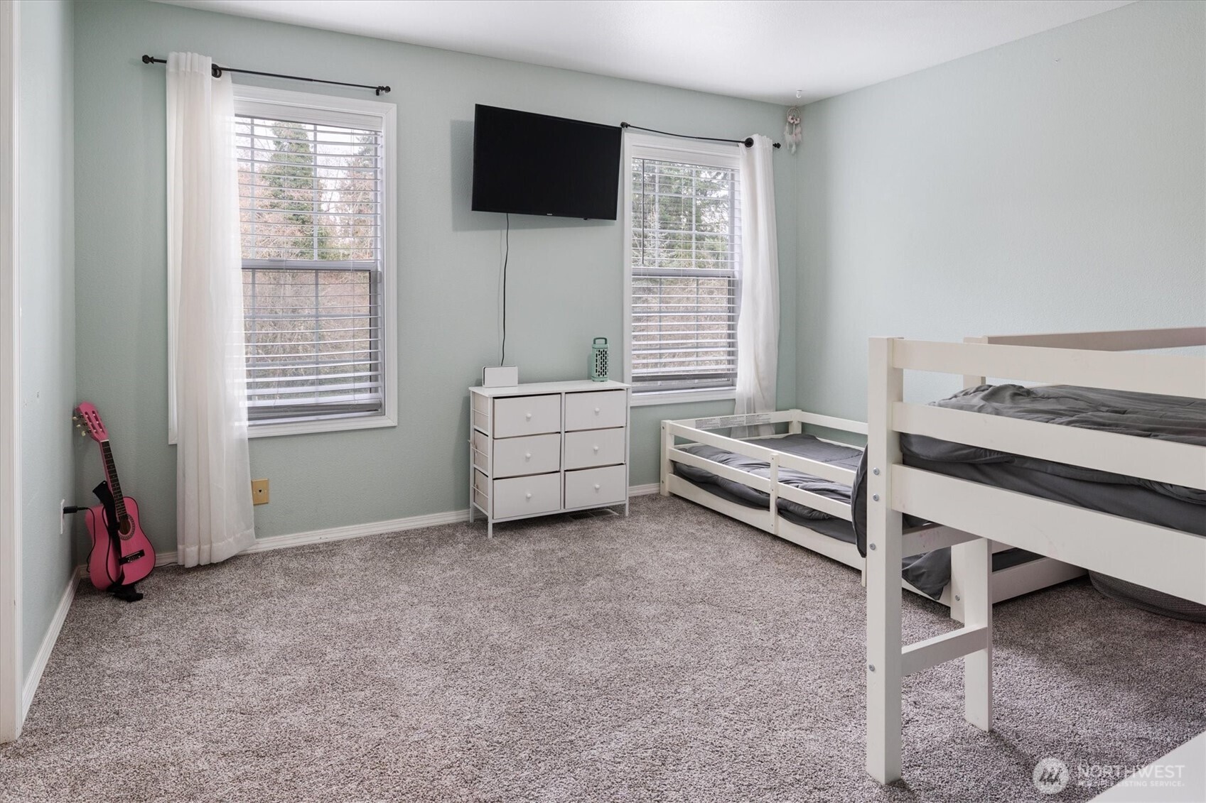 17018 45th Street East Lake Tapps, WA 98391 - Photo 25 of 40 a bedroom with furniture and a window