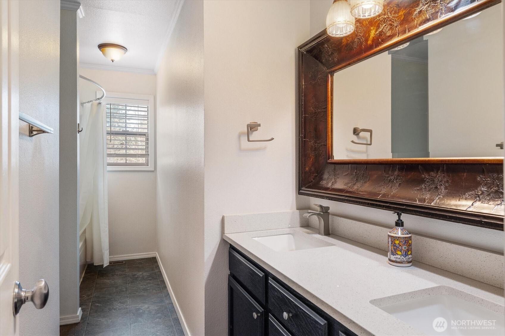 17018 45th Street East Lake Tapps, WA 98391 - Photo 26 of 40 a bathroom with a sink and a mirror
