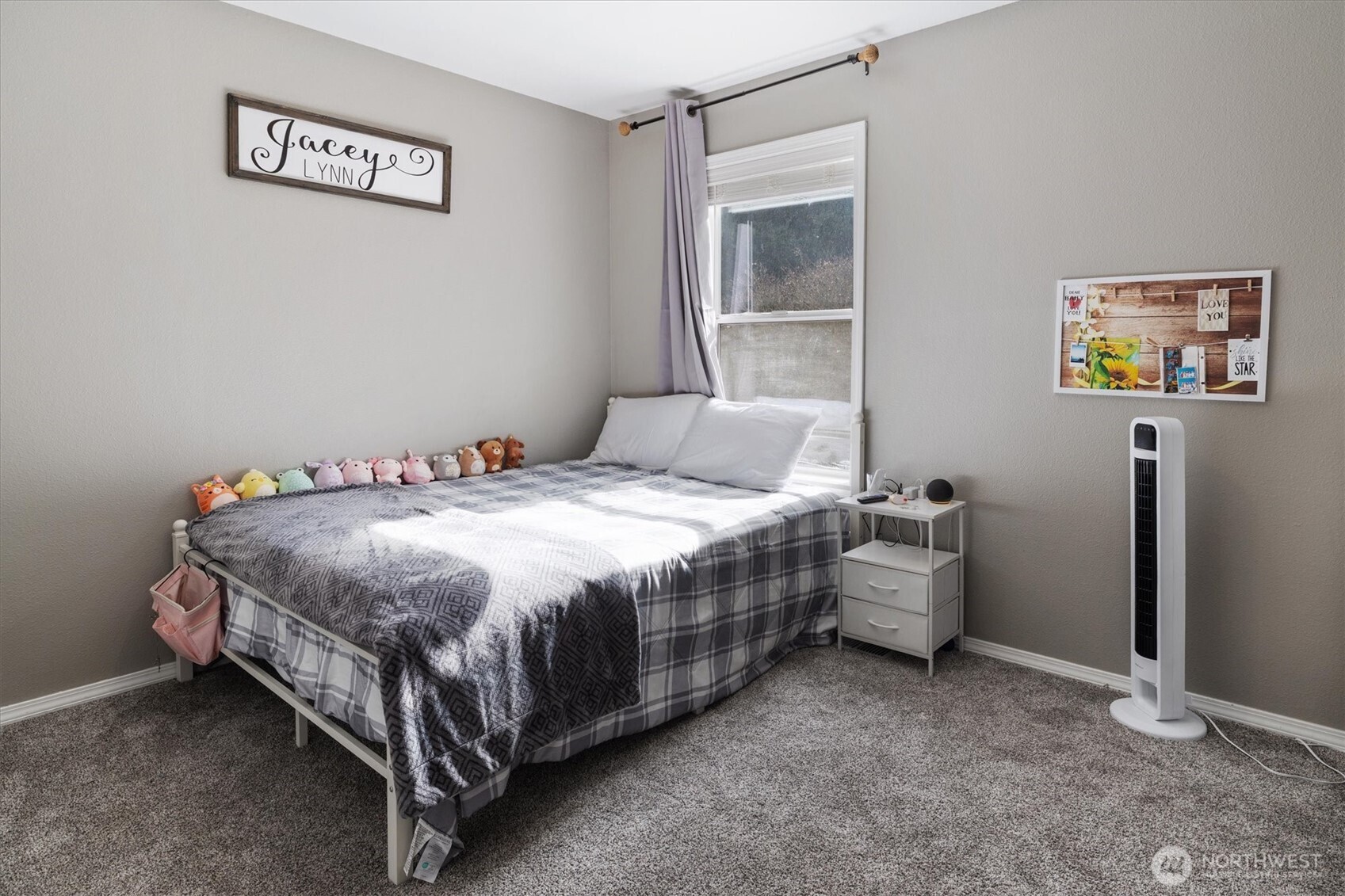 17018 45th Street East Lake Tapps, WA 98391 - Photo 27 of 40 a bed sitting in a bedroom next to a window