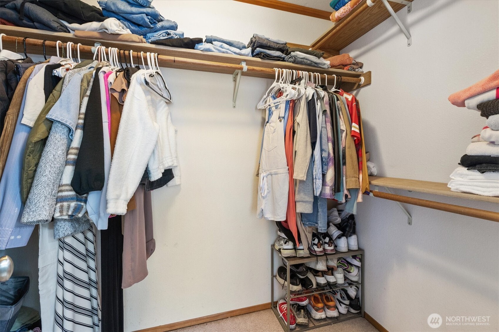 17018 45th Street East Lake Tapps, WA 98391 - Photo 28 of 40 a view of walk in closet with clothes and shoes