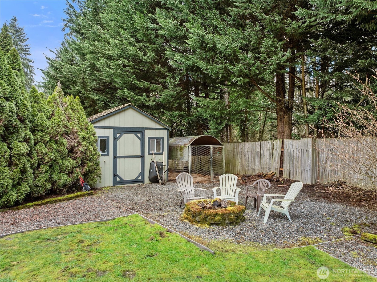 17018 45th Street East Lake Tapps, WA 98391 - Photo 36 of 40 a view of a chair and table in backyard of the house