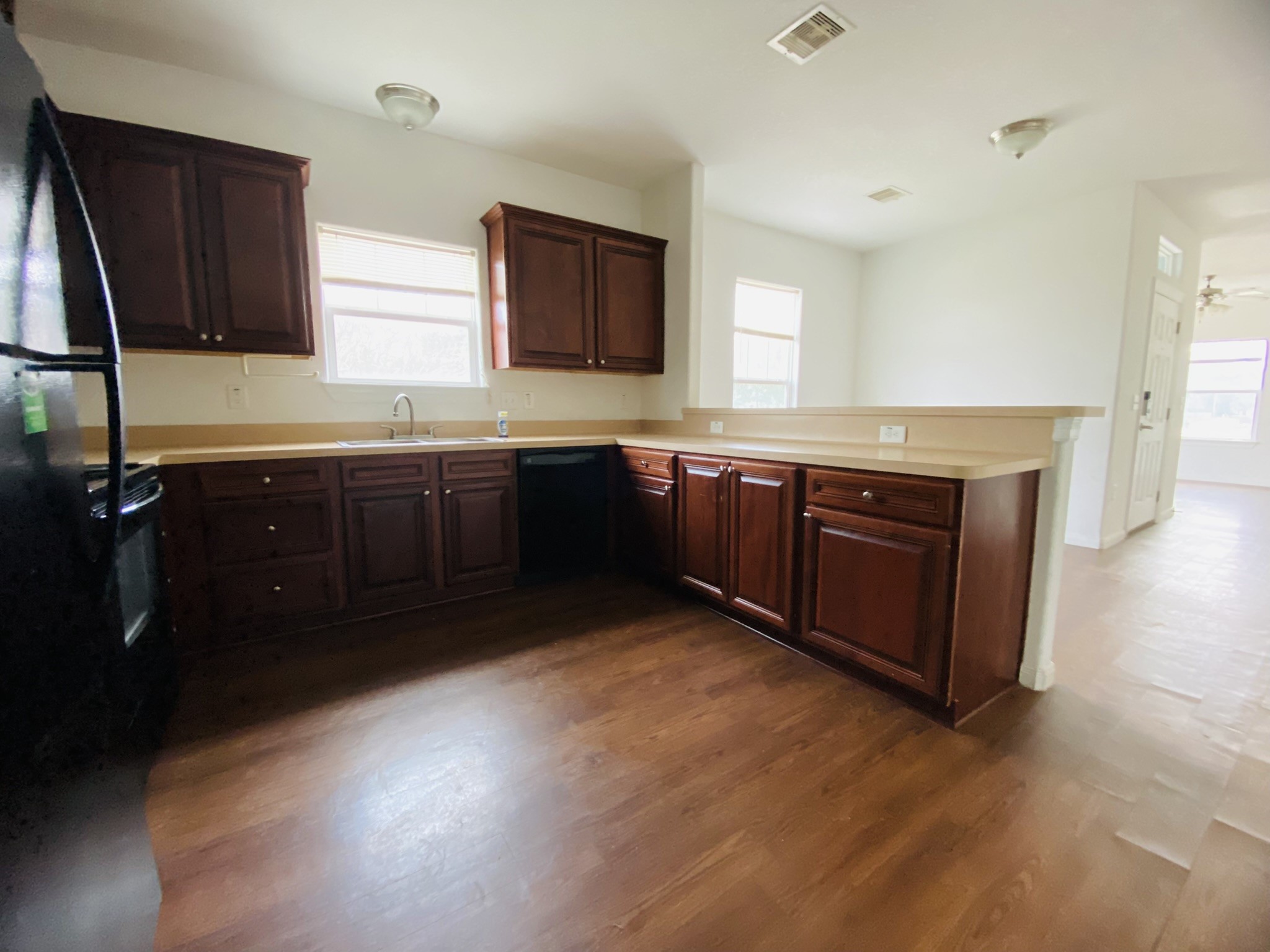 2503 Deats Road Dickinson, TX 77539 - Photo 10 of 28 a large kitchen with wooden cabinets and a sink