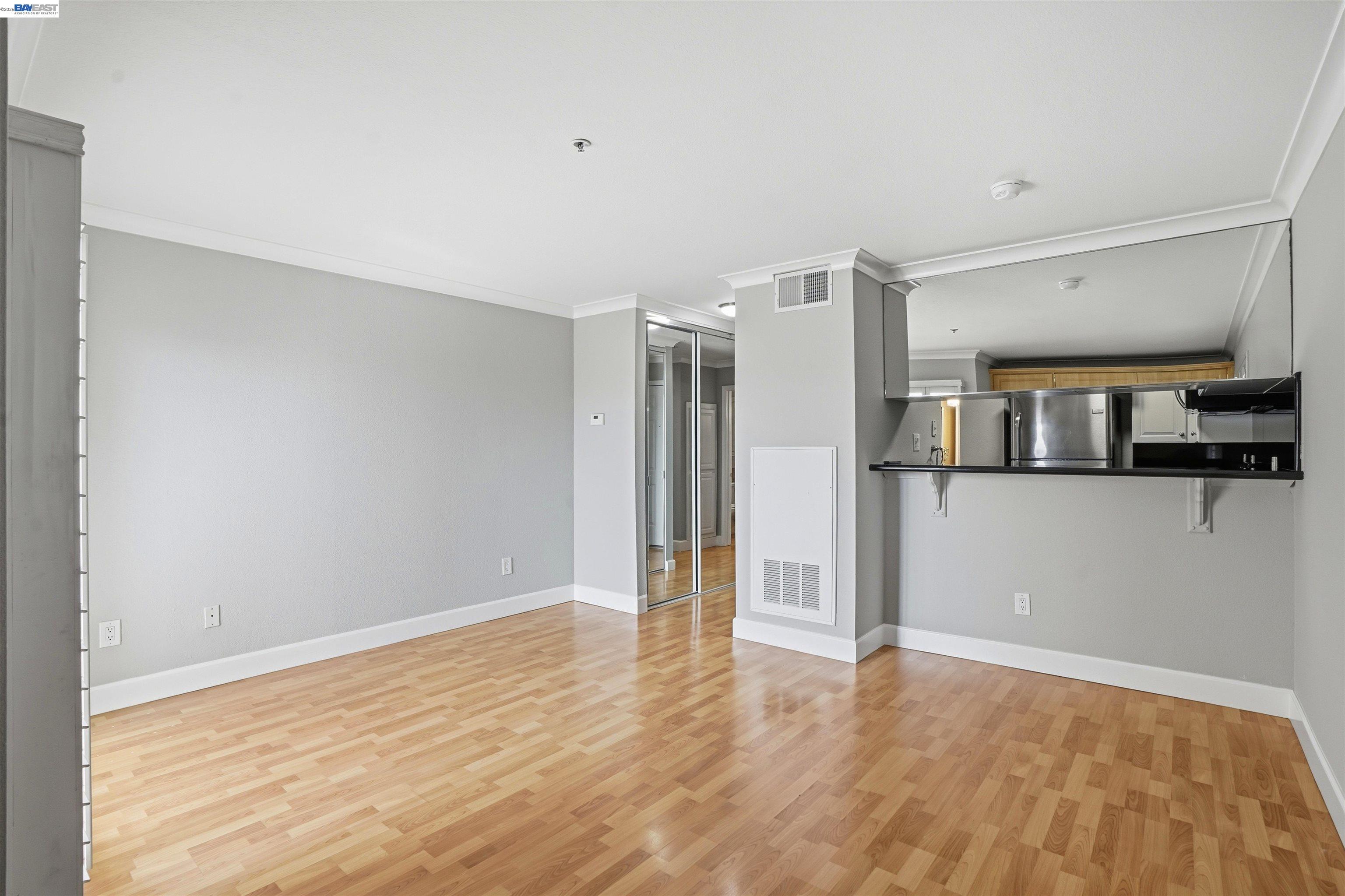 735 Watson Canyon Court, Unit 218 San Ramon, CA 94582 - Photo 3 of 18 a view of a big room with wooden floor and a kitchen