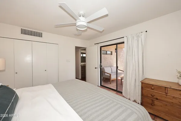 a bedroom with a bed and a cabinets