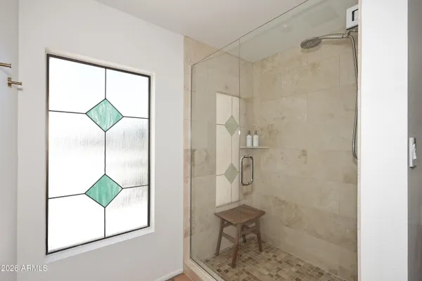 a bathroom that has a window in it