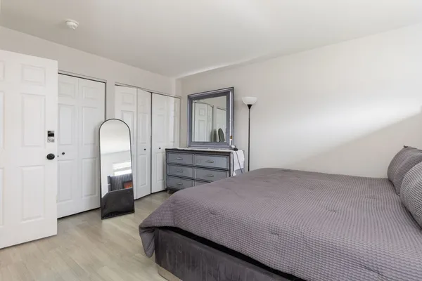 a bedroom with a bed and a dresser