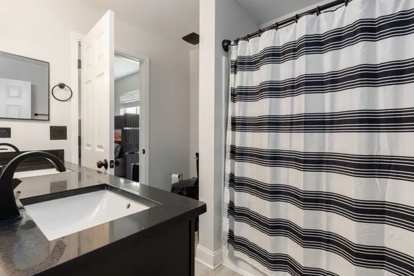 a kitchen with a refrigerator and a sink