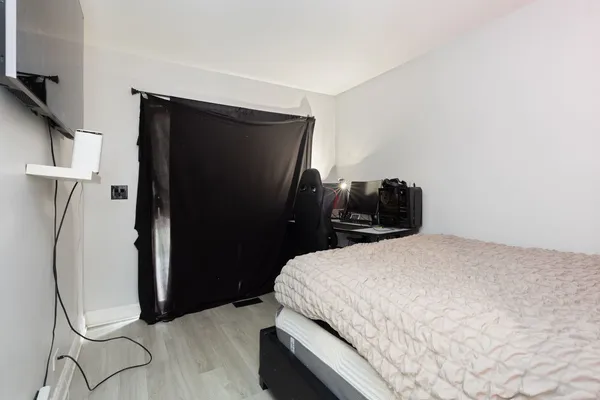 a bedroom with a bed and cabinets