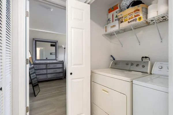 a view of storage and utility room with racks on the wall