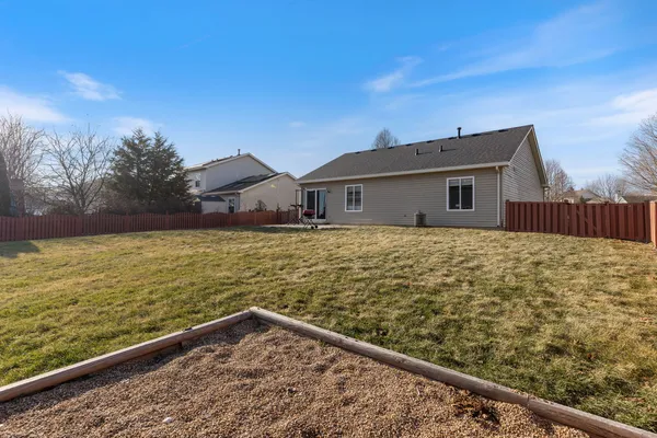 a view of a house with a yard from a balcony