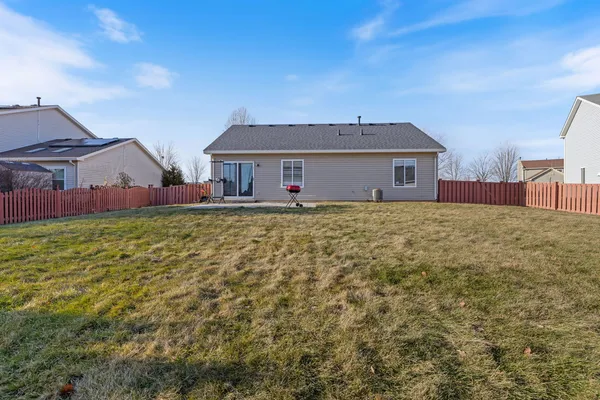 a view of a house with a yard