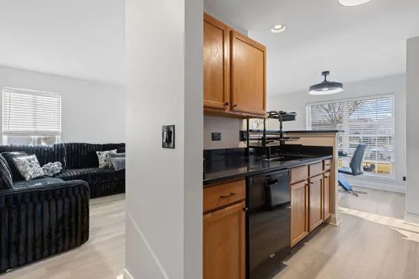 a kitchen with stainless steel appliances granite countertop a stove and a sink