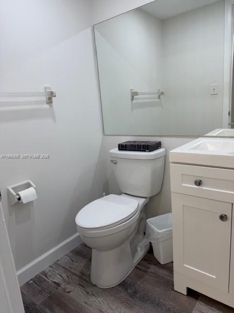 9370 Southwest 8th Street, Unit 418 Boca Raton, FL 33428 - Photo 11 of 19 a bathroom with a toilet and a sink