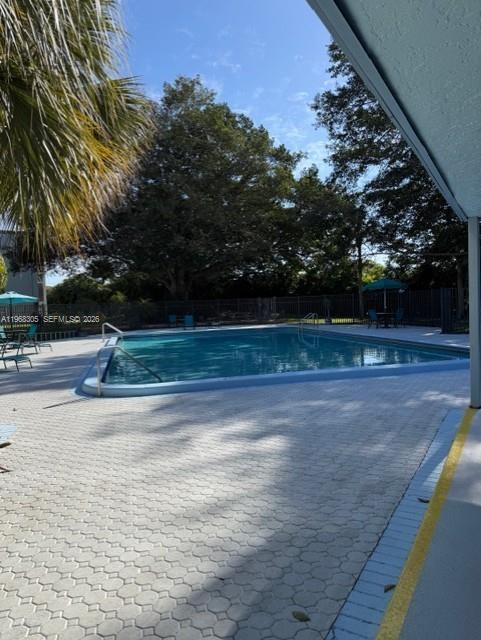 9370 Southwest 8th Street, Unit 418 Boca Raton, FL 33428 - Photo 17 of 19 a view of a fountain in front of a house