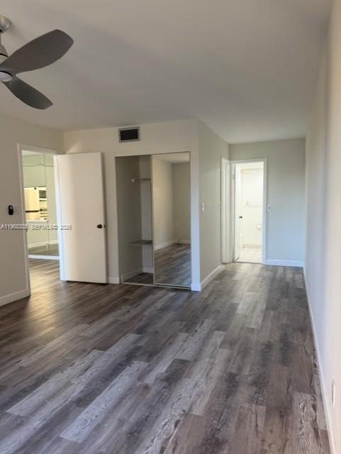 9370 Southwest 8th Street, Unit 418 Boca Raton, FL 33428 - Photo 3 of 19 a view of an empty room and wooden floor