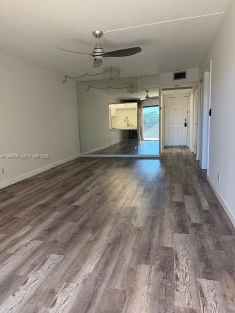 9370 Southwest 8th Street, Unit 418 Boca Raton, FL 33428 - Photo 5 of 19 a view of empty room with windows and cabinet