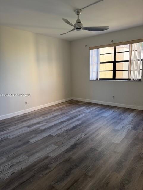 9370 Southwest 8th Street, Unit 418 Boca Raton, FL 33428 - Photo 6 of 19 wooden floor in an empty room with a window
