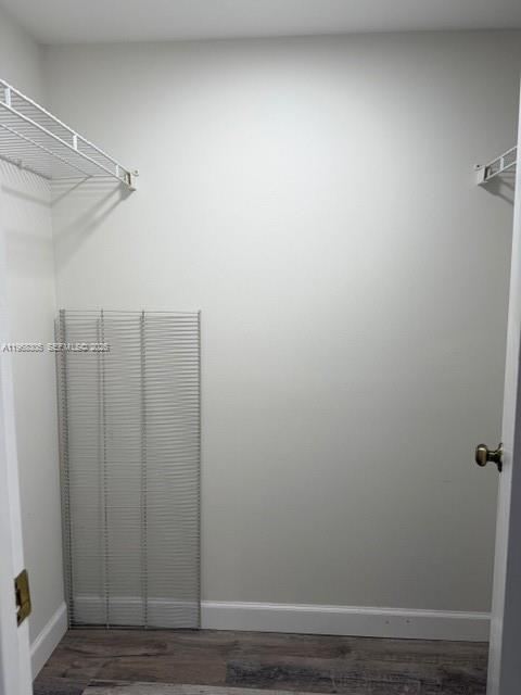 9370 Southwest 8th Street, Unit 418 Boca Raton, FL 33428 - Photo 8 of 19 a view of a room with wooden floor and cabinet