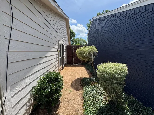 a vase of flowers sitting on a floor