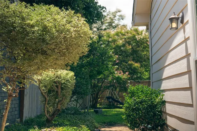 a view of a house with a tree