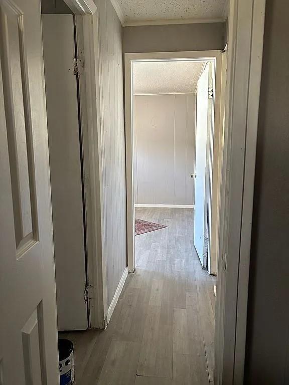 1711 Ash Street Commerce, TX 75428 - Photo 11 of 11 a view of a hallway with wooden floor
