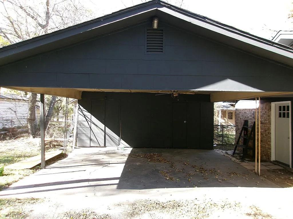 1711 Ash Street Commerce, TX 75428 - Photo 3 of 11 a black and white photo of a house