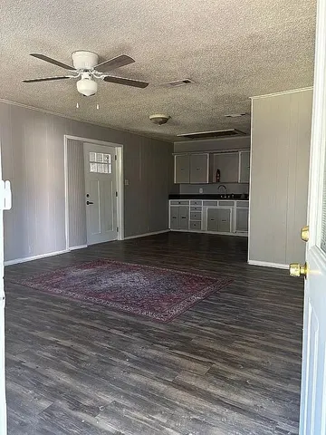 a large kitchen with stainless steel appliances granite countertop a stove and a refrigerator