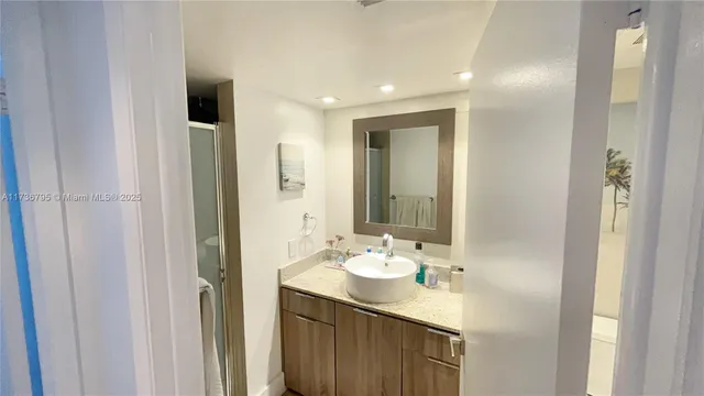 a bathroom with a sink and a mirror