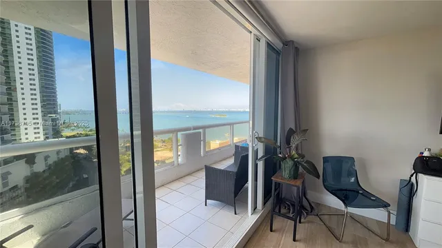 a view of a hallway with seating area