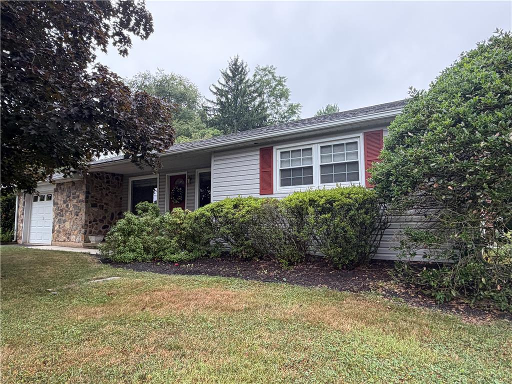 6830 Gun Club Road Coopersburg, PA 18036 - Photo 1 of 30 A charming facade features natural stone accents, vinyl siding, and well-maintained shrubbery, offering inviting curb appeal.