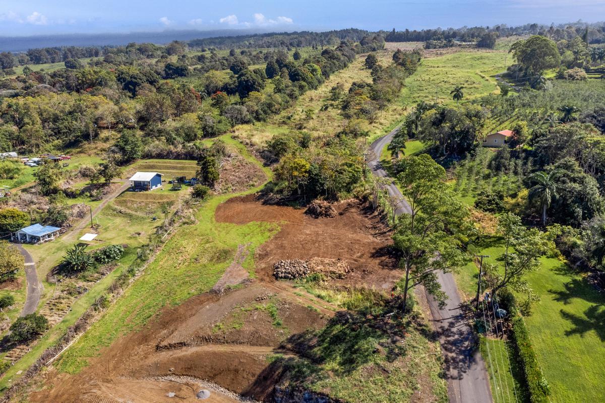 76-1015 Lot 2-a-2 Waiono Ranch Road Holualoa, HI 96725 - Photo 29 of 29 a view of a houses with a lush green hillside