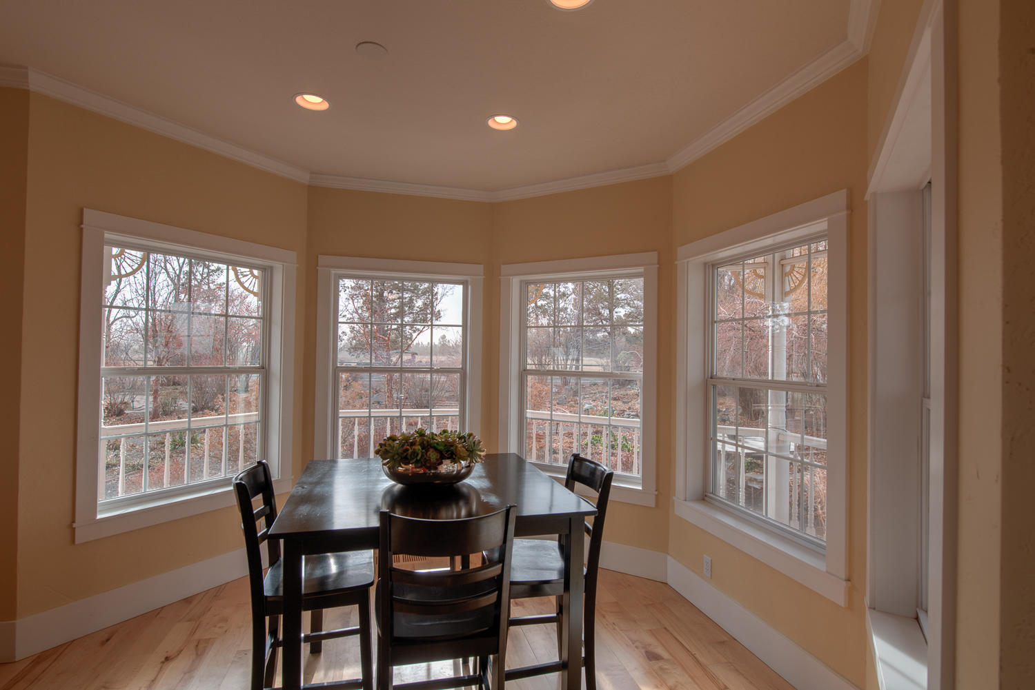 22222 Erickson Road Bend, OR 97701 - Photo 10 of 100 a view of a dining room with furniture window and wooden floor