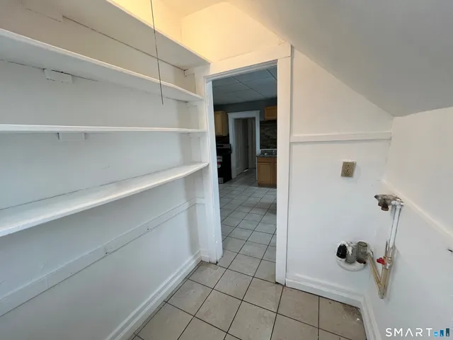 a view of room with window and ceiling fan