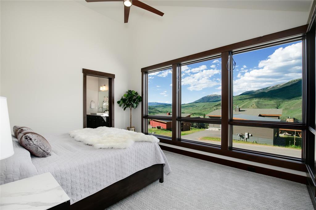 55 Glazer Trail Silverthorne, CO 80498 - Photo 15 of 35 a bedroom with a bed and large window