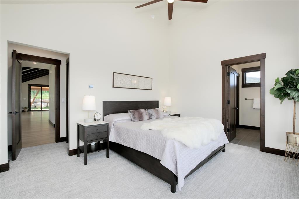 55 Glazer Trail Silverthorne, CO 80498 - Photo 16 of 35 a bedroom with a bed and a table in it