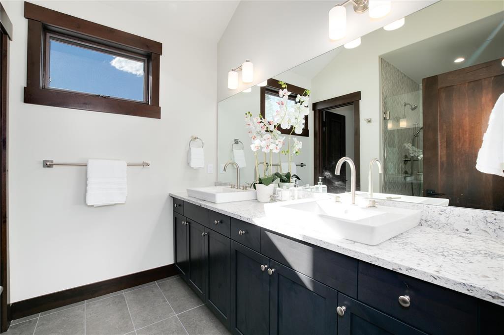55 Glazer Trail Silverthorne, CO 80498 - Photo 18 of 35 a bathroom with a sink double vanity and a mirror