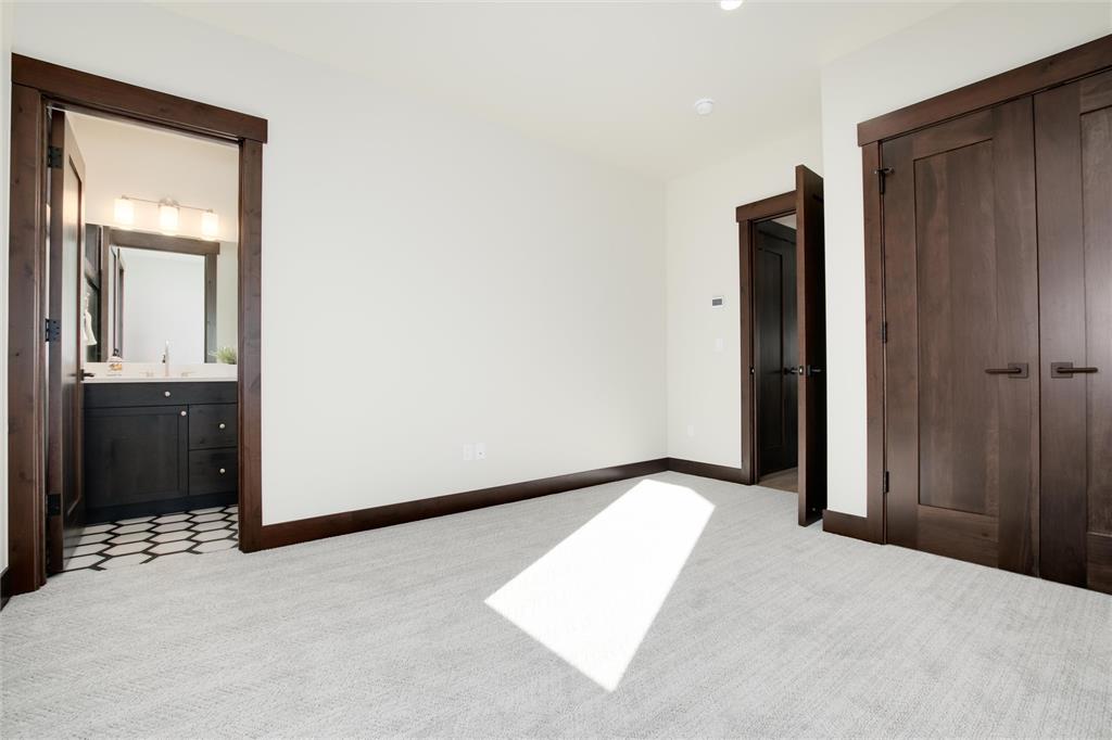 55 Glazer Trail Silverthorne, CO 80498 - Photo 19 of 35 an empty room with closet and mirror