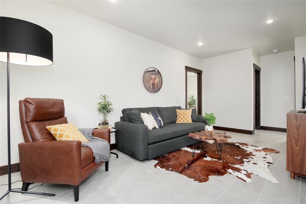 55 Glazer Trail Silverthorne, CO 80498 - Photo 24 of 35 a living room with furniture and wooden floor