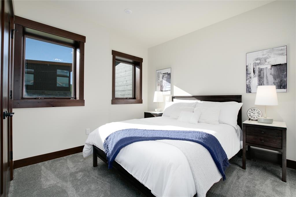 55 Glazer Trail Silverthorne, CO 80498 - Photo 25 of 35 a bedroom with a bed and two windows