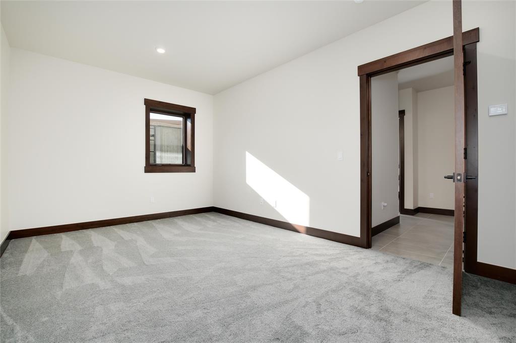 55 Glazer Trail Silverthorne, CO 80498 - Photo 27 of 35 an empty room with a cabinet and a window