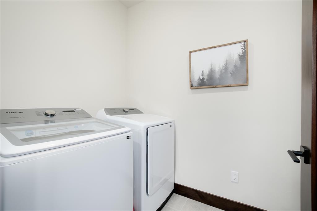 55 Glazer Trail Silverthorne, CO 80498 - Photo 28 of 35 a utility room with dryer and washer