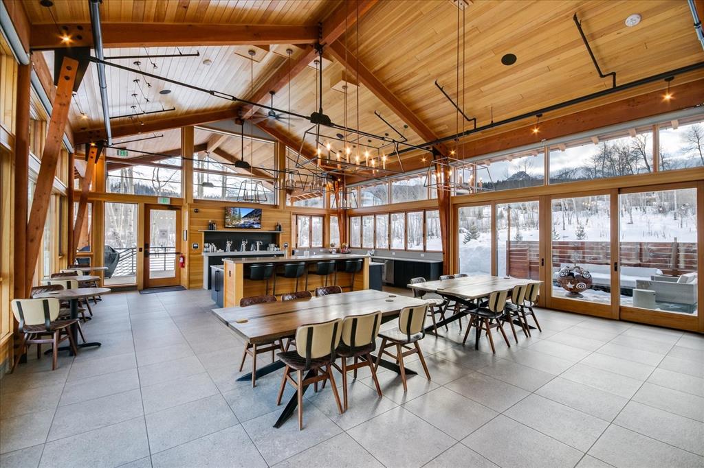 55 Glazer Trail Silverthorne, CO 80498 - Photo 32 of 35 a view of a dining hall with many windows