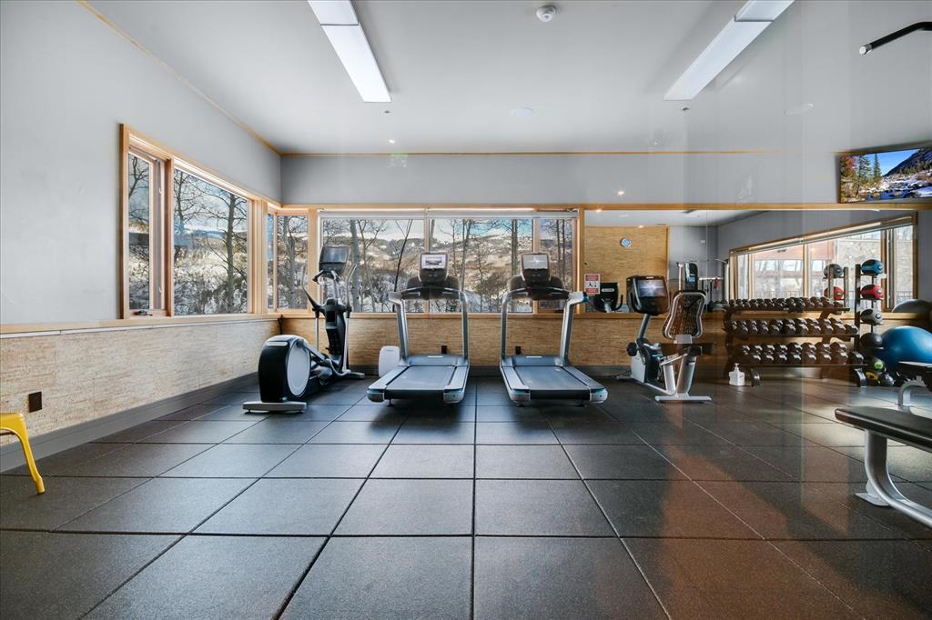 55 Glazer Trail Silverthorne, CO 80498 - Photo 34 of 35 a gym room with lots of furniture and a large window