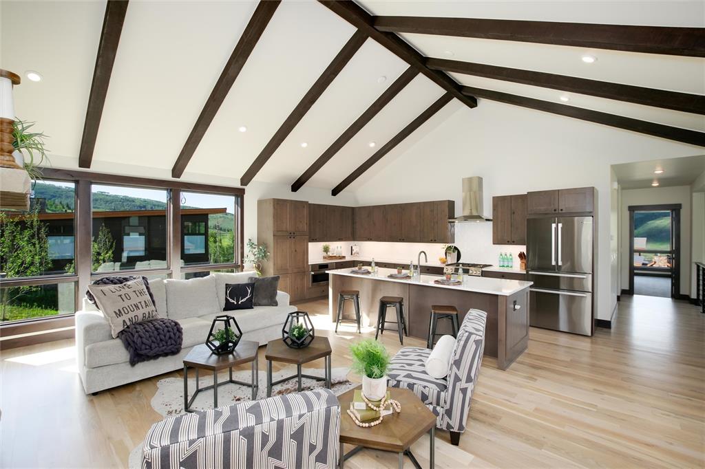 55 Glazer Trail Silverthorne, CO 80498 - Photo 8 of 35 a view of a dining room with furniture window and wooden floor