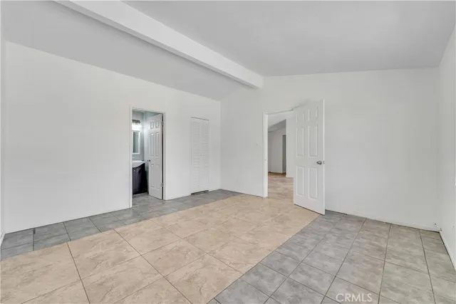 a view of an empty room with a fireplace