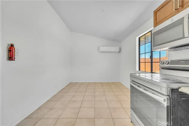 a kitchen with a sink cabinets and a window