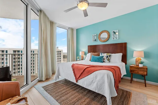 a bedroom with a bed and a chandelier