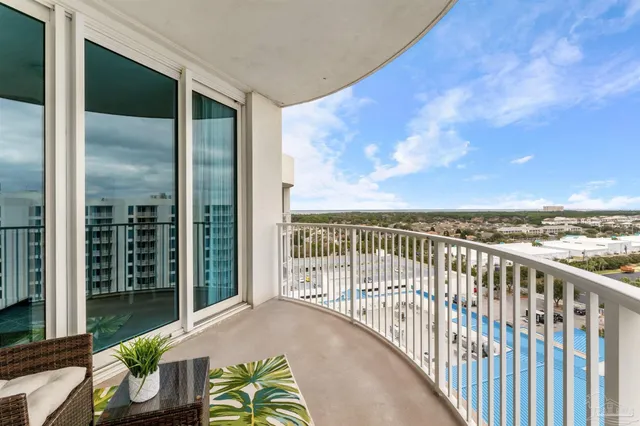 a view of balcony with furniture