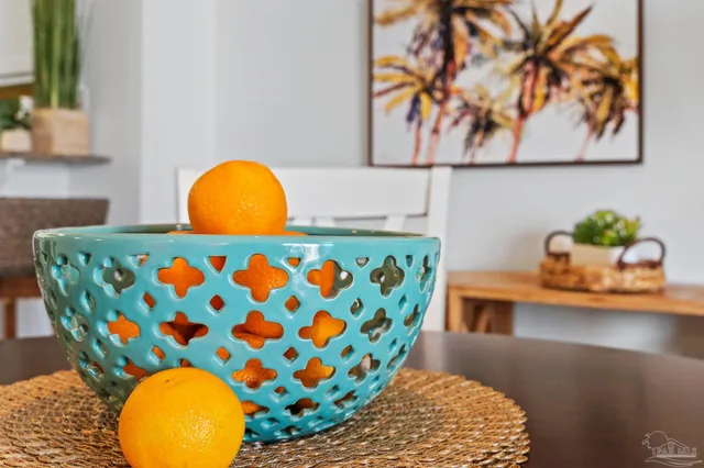 a living room with furniture and painting on the wall