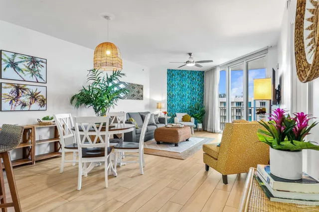 a living room with furniture and a potted plant